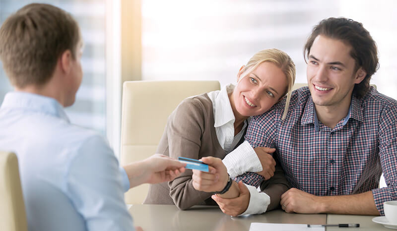 Young couple talking with financial professional, financial planning